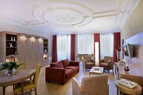 Luxurious living room in Strasbourg City Centre Aparthotel with elegant furniture and classic decor.