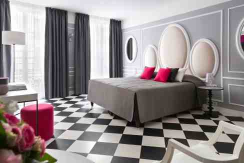 Luxurious hotel room at Paris Opéra Aparthotel with modern design and chic furnishings.