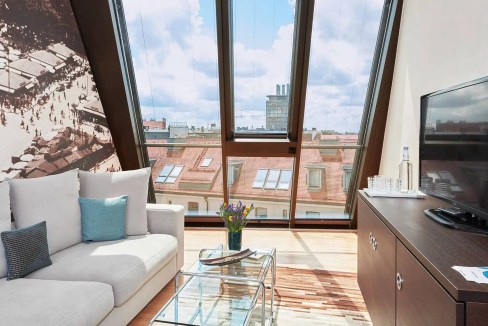 Bright apartment with large windows overlooking Munich's historic Altstadt district.
