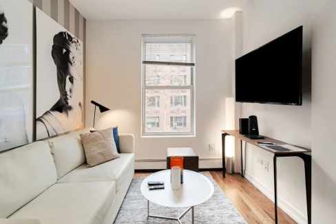 Cozy living room in a stylish Upper East Side serviced apartment with contemporary decor and natural.
