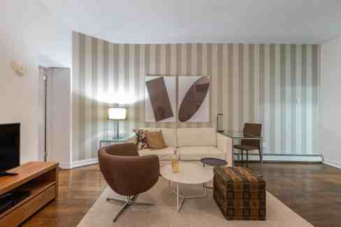 Upper East Side 2nd Avenue Apartments living room with stylish furniture and contemporary decor.
