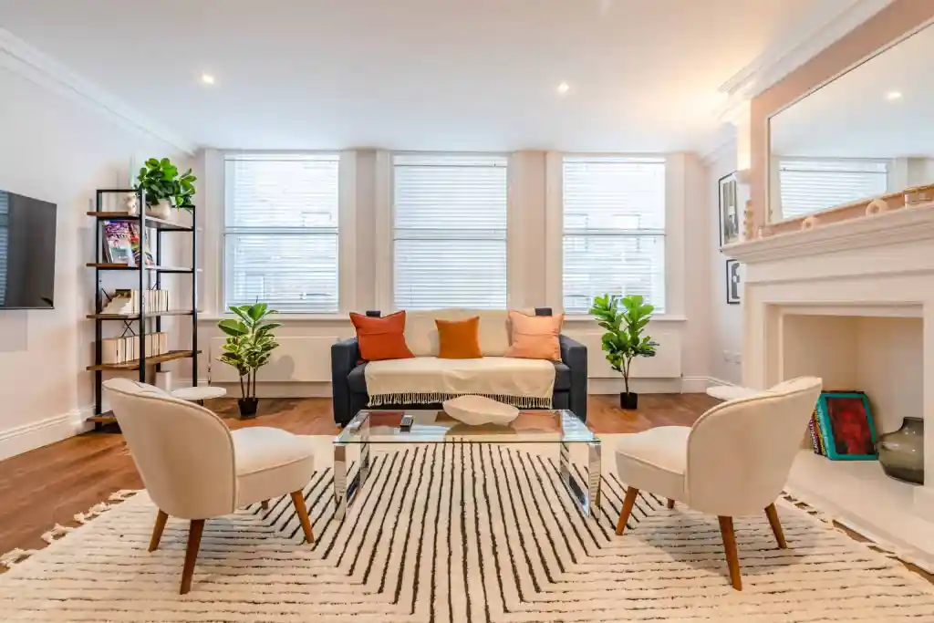 Modern Soho Greek Street Apartments living room with stylish furniture and natural light.