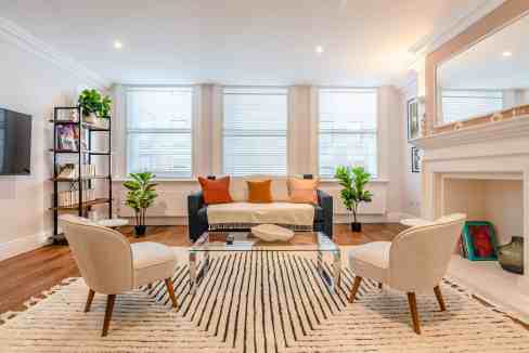 Modern Soho Greek Street Apartments living room with stylish furniture and natural light.