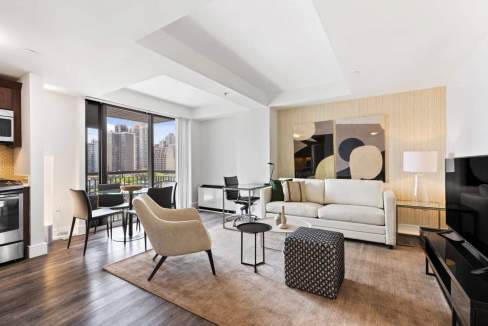 Spacious living room in Yorkville 1st Avenue Apartments with contemporary furniture and natural ligh.