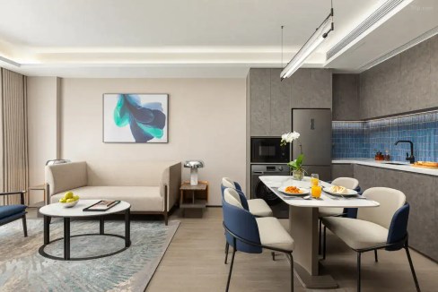 Stylish interior with contemporary furniture, cozy seating, and a functional kitchen space.