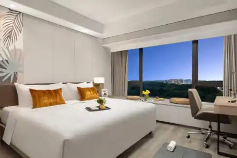 Elegant hotel room with sea view at Bo'ao Seaside Aparthotel, featuring modern decor and comfortable.