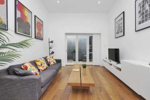 Stylish Hackney apartment living room with contemporary decor and bright atmosphere.