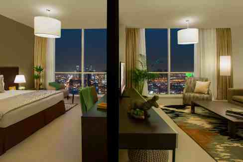 Elegant hotel room at Riyadh Rafal Olaya Aparthotel with city views.