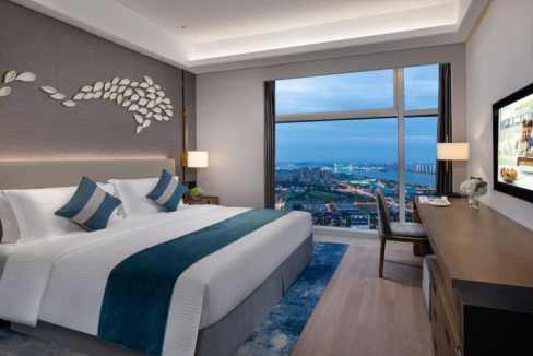 Hotel room with panoramic cityscape view at Changsha Financial Centre Aparthotel.