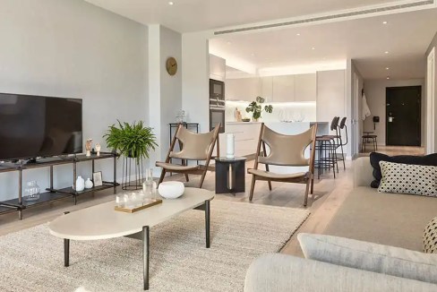 Bright and spacious living room in Camden Hawley Wharf Apartments with modern decor.
