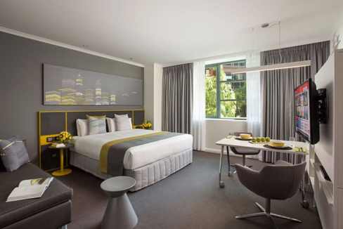 Apt hotel room at Perth Elizabeth Quay with contemporary design, large window, and comfortable furni.