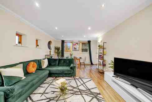 Bright and spacious living room with contemporary decor in Maritime Quay Apartments. Perfect for rel.