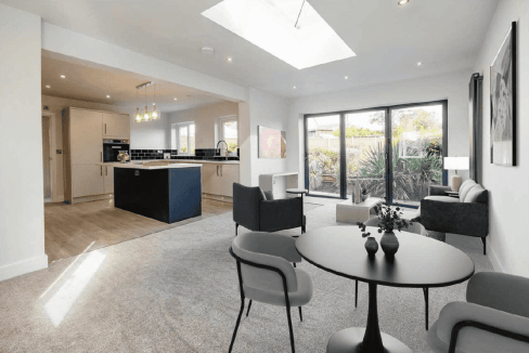 Bright, airy interior featuring contemporary decor and large windows overlooking the garden.