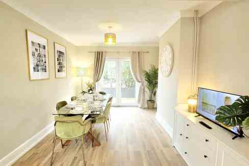 Bright, airy interior with a stylish dining table and contemporary furnishings.