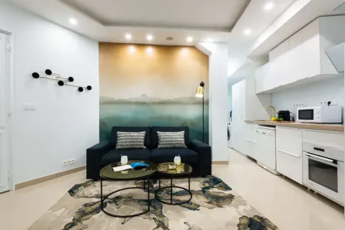 Cozy living room in Rue La Fayette Apartments with stylish decor and contemporary furniture.