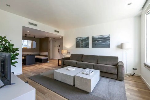 Stylish living room in Passeig de Gràcia Apartments with modern furniture and bright ambiance.