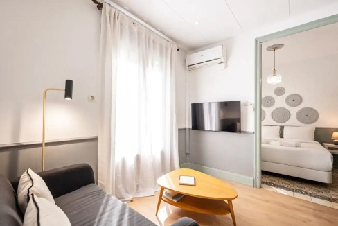 Modern Barcelona Sagrada Familia Apartments living room with stylish decor and natural light.