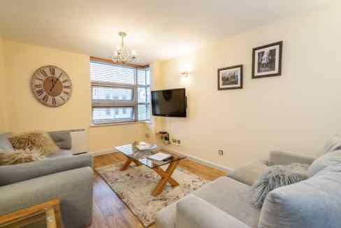 Cozy living room at Westgate Apartments with modern decor and comfortable seating.