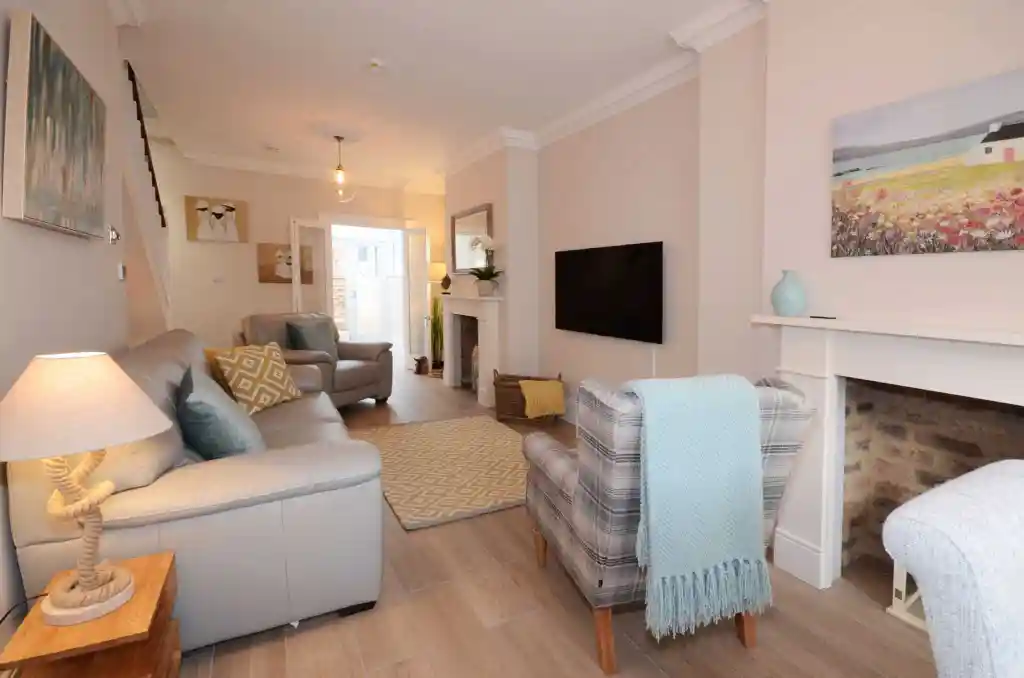 Bright and inviting living room with comfortable sofas and modern decor. Perfect for relaxing and en.