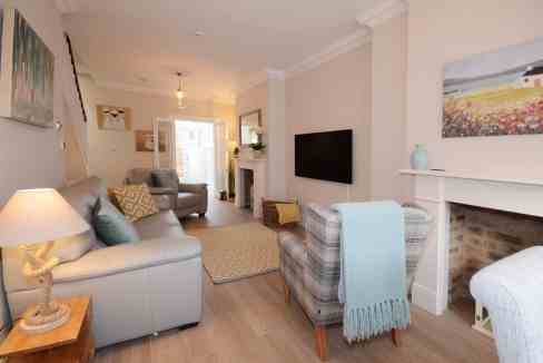 Bright and inviting living room with comfortable sofas and modern decor. Perfect for relaxing and en.