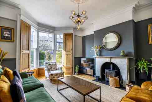 Bright and inviting living space with large windows, stylish furniture, and elegant decor in York.