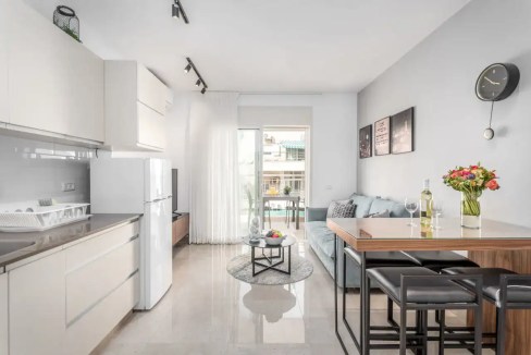 Bright, modern Mahaneh Yehudah Market Apartments living room with minimalist decor and natural light.