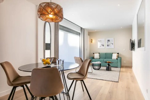 Bright, stylish living room with contemporary furniture and natural light at Place Dauphine Apartmen.