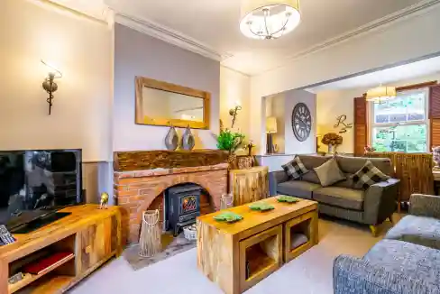 Comfortable living space with modern furnishings and a warm fireplace. Perfect for relaxing and ente.