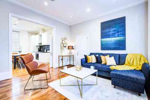 Stylish living room with contemporary furniture and vibrant decor in Battersea Park Road Apartments.