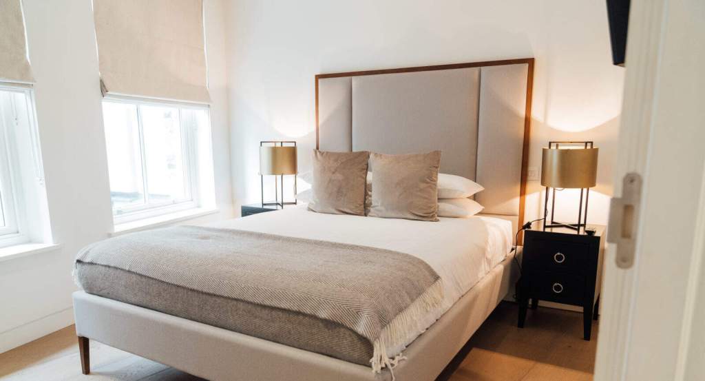 Elegant bedroom in Marylebone Lane with contemporary design and cozy ambiance.