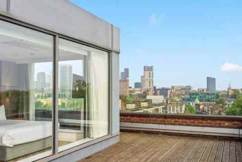 Balcony view of city skyline from Stratford Park Aparthotel apartment.