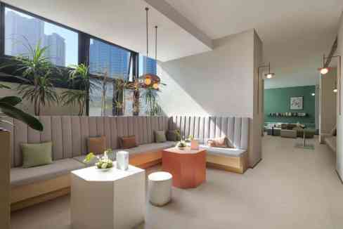 Modern Shenzhen Guanlan Aparthotel lounge with stylish seating and natural light.