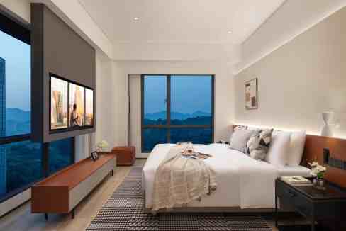 Hotel room with large windows and cityscape view at Shangwan Chayuan Aparthotel.