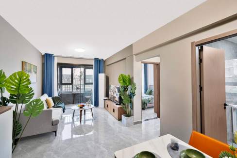 Modern living room at Jinan North Aparthotel with contemporary furniture and large windows.
