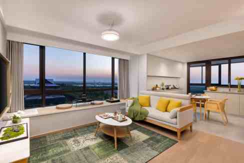 Spacious living room with large windows, modern furniture, and scenic views at Ningbo Hangzhou Bay A.