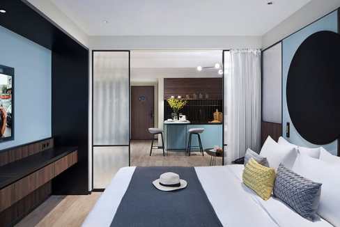 Modern hotel room at Shanghai Hongqiao Center Aparthotel with stylish decor.