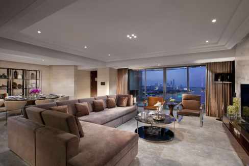 Spacious modern living room at Guangzhou Qian Hangdao Aparthotel with city views and elegant decor.