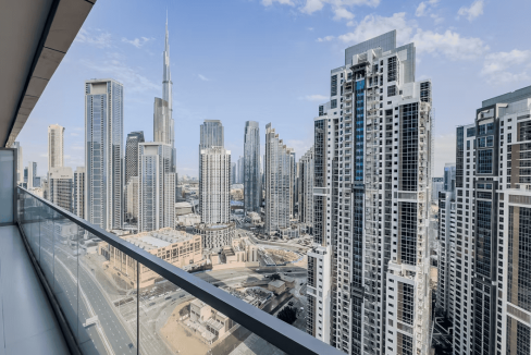 Stunning view of Dubai skyline with skyscrapers from Midtown hotel balcony.