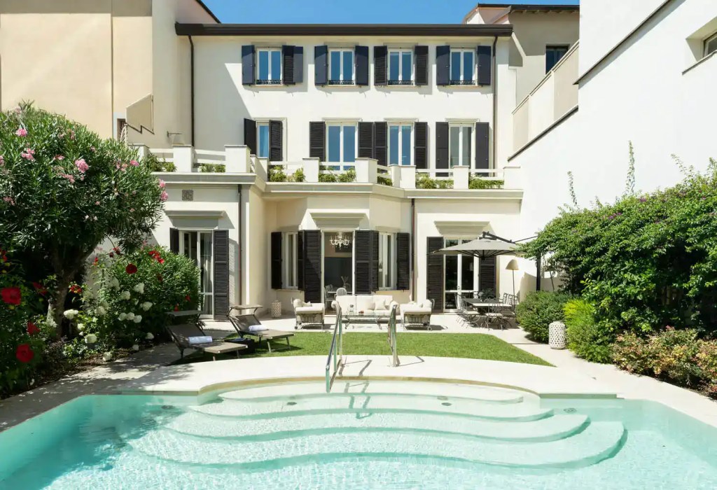 Luxury villa with private pool in Viareggio, Tuscany, offering elegant outdoor living spaces and lus.