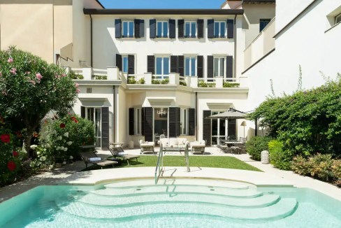 Luxury villa with private pool in Viareggio, Tuscany, offering elegant outdoor living spaces and lus.
