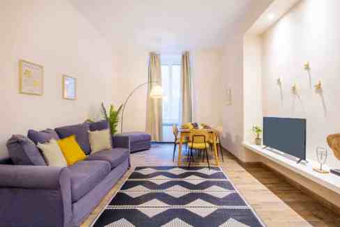 Stylish Milan Moscova Apartments living room with comfortable sofa and contemporary decor.