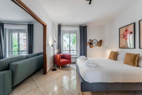 Modern hotel room at Viale Piave Apartments with stylish decor and natural light.