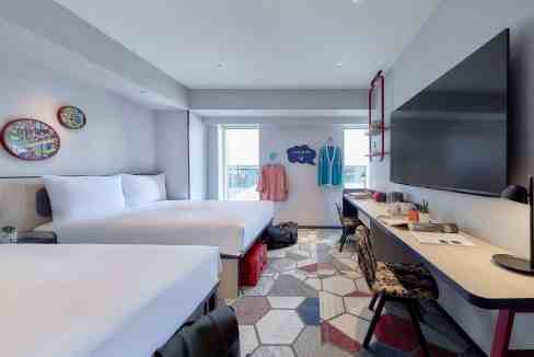 Modern Tokyo Udagawacho Aparthotel room with city view and contemporary decor.