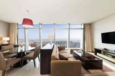 A spacious living room at Incheon Songdo Convensia Aparthotel featuring large windows and contempora.