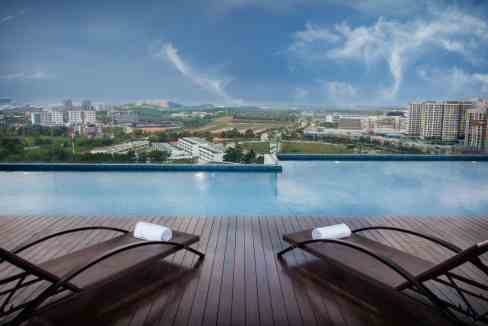 Rooftop pool at Cyberjaya DPulze Aparthotel offering stunning cityscape views and modern amenities.