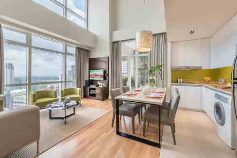 Bright living area with large windows and city views in Manila Makati Salcedo Aparthotel.