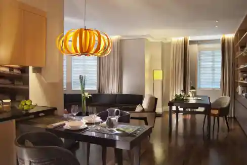 Elegant interior of a Singapore Raffles Quay Aparthotel living space with stylish furniture and warm.