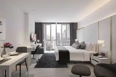 Bright, spacious hotel room in Bangkok with contemporary decor and large windows overlooking the cit.