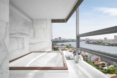 Luxury bathroom with a marble bathtub and stunning city views in Ho Chi Minh City.