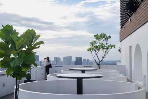 Rooftop terrace at Hanoi West Point Aparthotel with city views and modern outdoor seating.